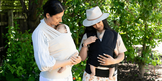 Two mums babywearing with BabyDink