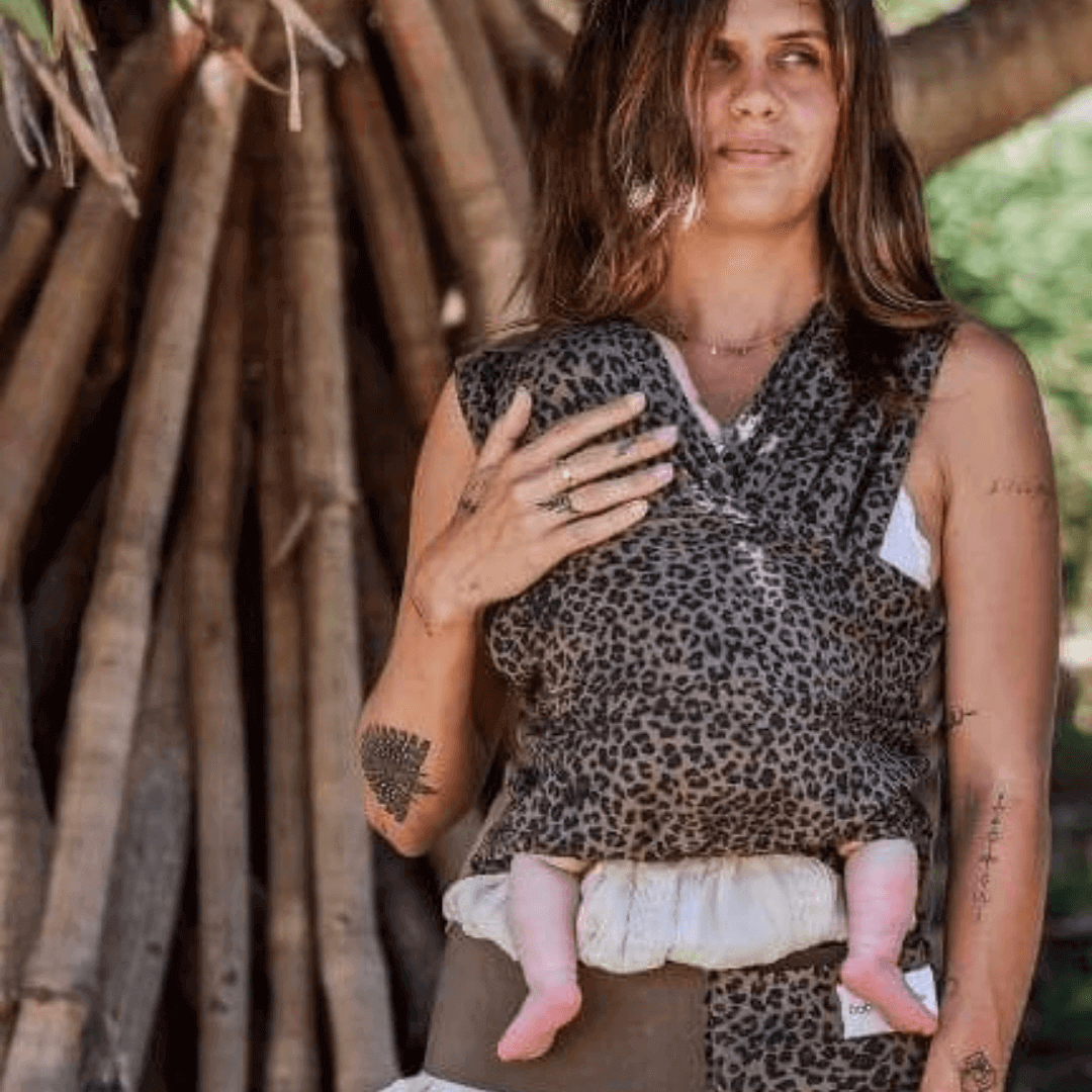 Mum at the woods babywearing using BabyDink Carrier in Color Leopard